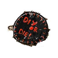 A black pin with red text: 'DIY or die'.