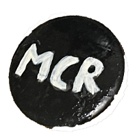 MCR (my chemical romance) in white text on a black pin.
