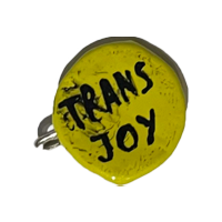 A yellow pin with black text: 'Trans joy'